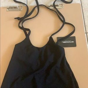 Black dungaree style mini skirt